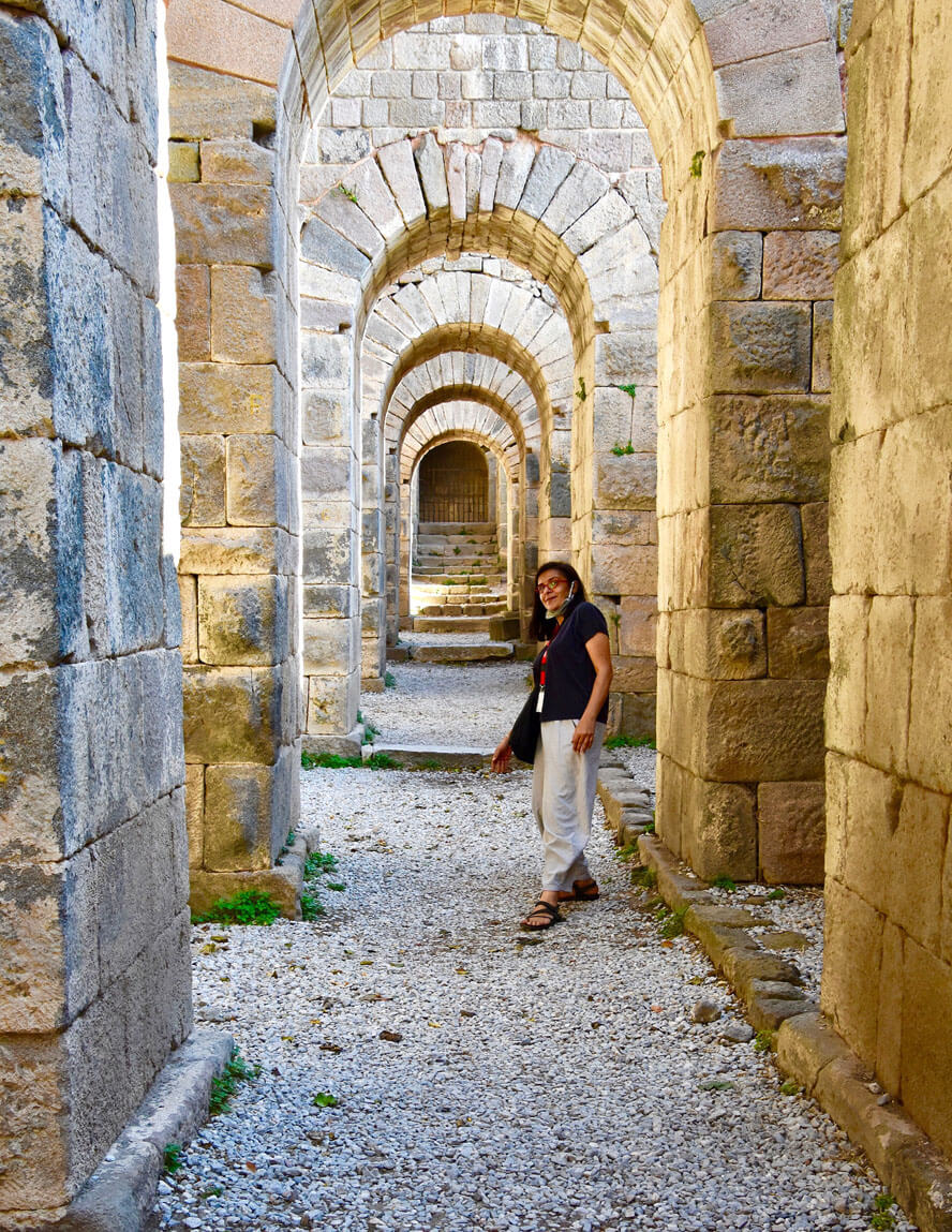 Yasemin under the Trajaneum. Pergamon – Visiting Turkey’s Roman Stronghold.